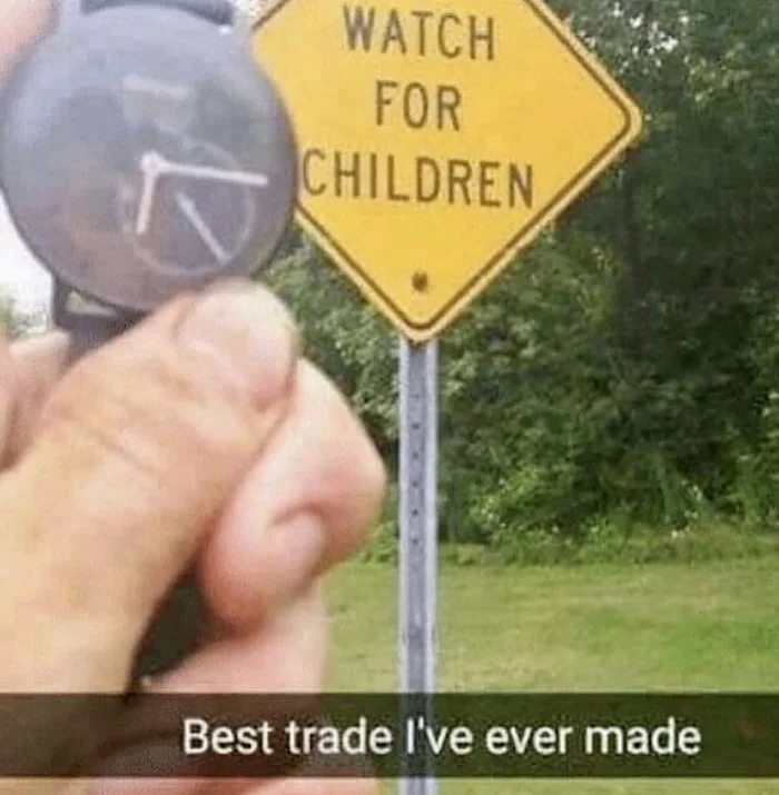 Dad joke. Someone holds a compass in front of a "Watch for Children" road sign, making a visual pun about the trade. Text: WATCH FOR CHILDREN / Best trade I've ever made