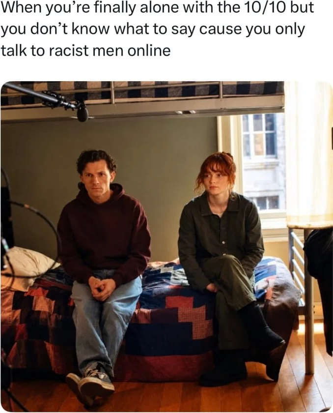 Two people sitting awkwardly on a bed looking uncomfortable and avoiding eye contact with each other. Text: When you're finally alone with the 10/10 but you don't know what to say cause you only talk to racist men online