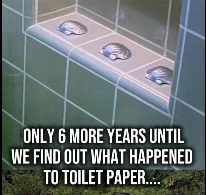 Still trying to figure out how to use these. Three seashell-like fixtures mounted on a bathroom tile wall, referencing the futuristic toilet paper mystery. Text: ONLY 6 MORE YEARS UNTIL WE FIND OUT WHAT HAPPENED TO TOILET PAPER