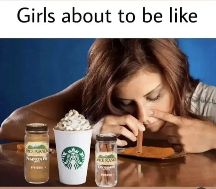 Sales about to go up. Woman leaning over pumpkin spice-themed products with whipped cream coffee cup. Text: Girls about to be like