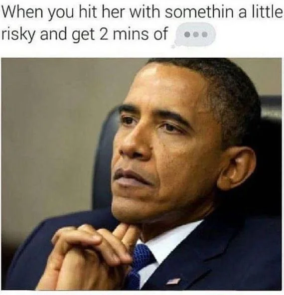 Man in suit with thoughtful expression waiting for response after making a risky comment. Text: When you hit her with something a little risky and get 2 mins of