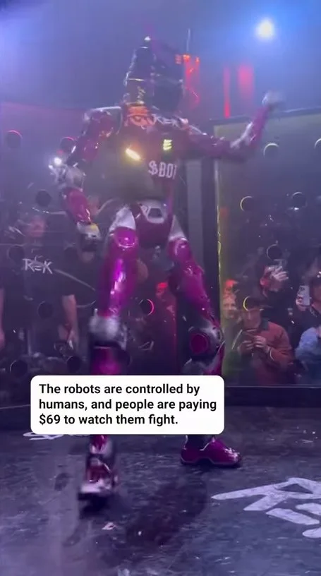 Large illuminated fighting robots in a darkened arena surrounded by spectators during a combat event. Text: The robots are controlled by humans, and people are paying $69 to watch them fight. / $69 / ROK