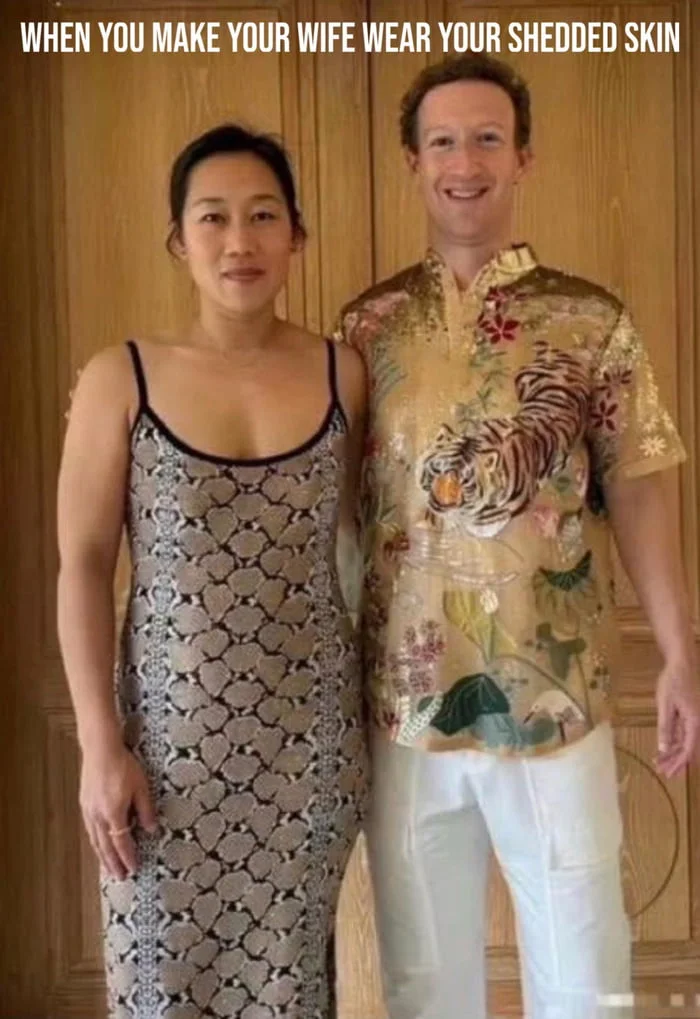 A man wearing a patterned shirt with animal prints stands next to a woman in a textured dress, posed for a photo. Text: WHEN YOU MAKE YOUR WIFE WEAR YOUR SHEDDED SKIN