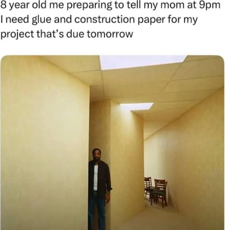 Man standing in an empty yellow-walled room, looking anxious or worried about an impending conversation. Text: 8 year old me preparing to tell my mom at 9pm I need glue and construction paper for my project that's due tomorrow