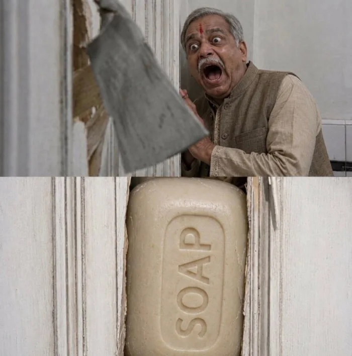 Here's Johnny!. Man reacting with shock and disgust upon discovering a large bar of soap instead of expected item. Text: SOAP
