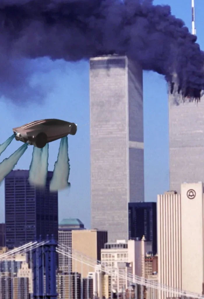 That one guy. A street lamp with a car balanced on top overlooking a cityscape with smoking twin towers