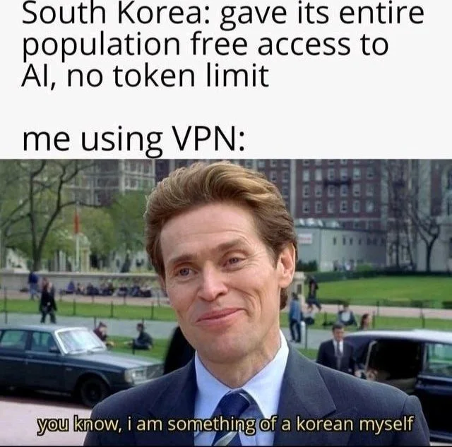 VPN loophole energy. Man in suit smirking, joking about using a VPN to access South Korea's AI as if he were Korean. Text: South Korea: gave its entire population free access to AI, no token limit / me using VPN: / you know, i am something of a korean myself
