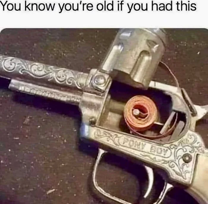Pony boy?. A decorative revolver with a rolled-up penny visible in the chamber, referencing a vintage toy or novelty item. Text: You know you're old if you had this