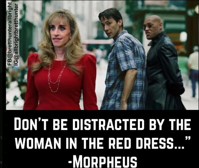 A woman in a red dress stands in front of two men, with a quote about distraction attributed to Morpheus. Text: DON'T BE DISTRACTED BY THE WOMAN IN THE RED DRESS..." -MORPHEUS / F@Dbtunerallnight / @allbrightedtwinter